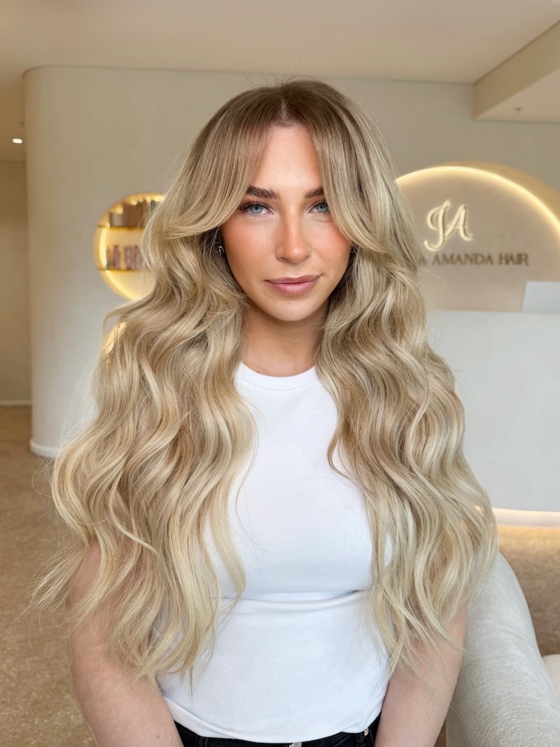Long blonde waves styled in salon at Jessica Amanda Hair Artistry, West Perth